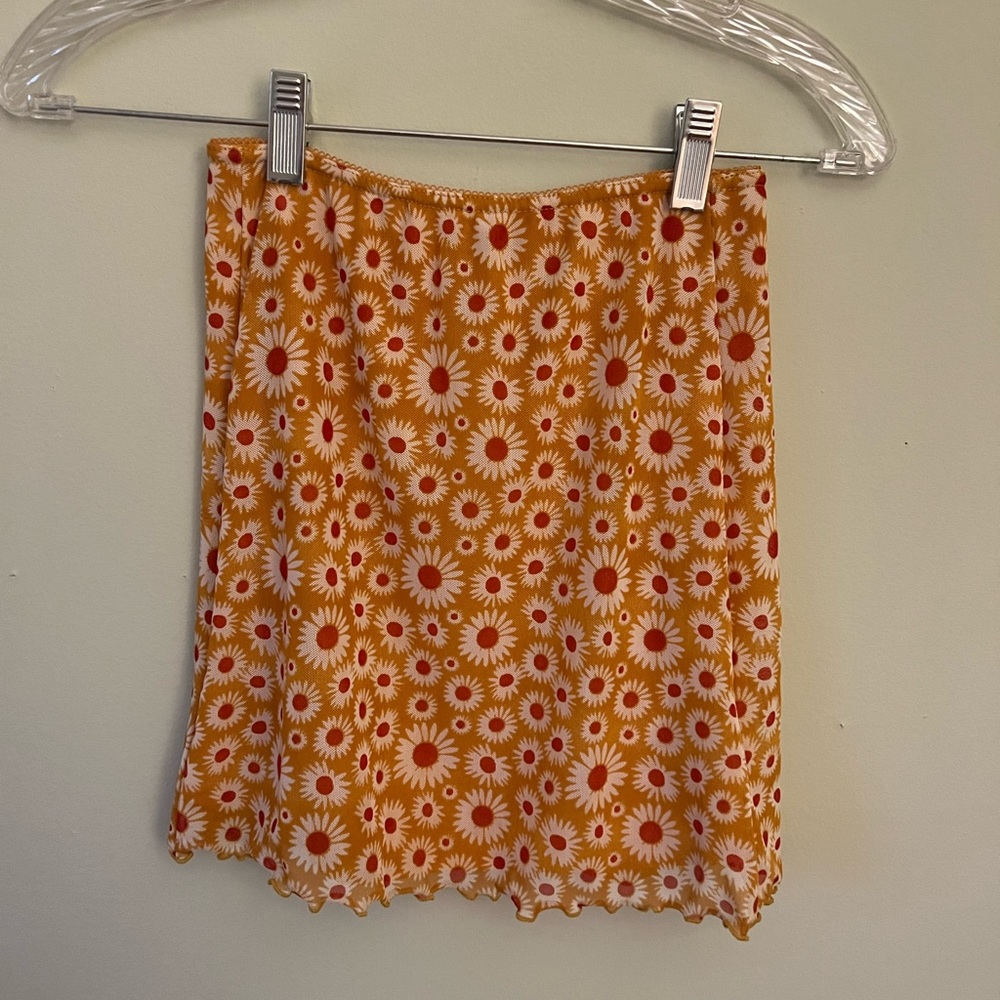 Urban Outfitters orange daisy mini skirt, cute and comfortable.